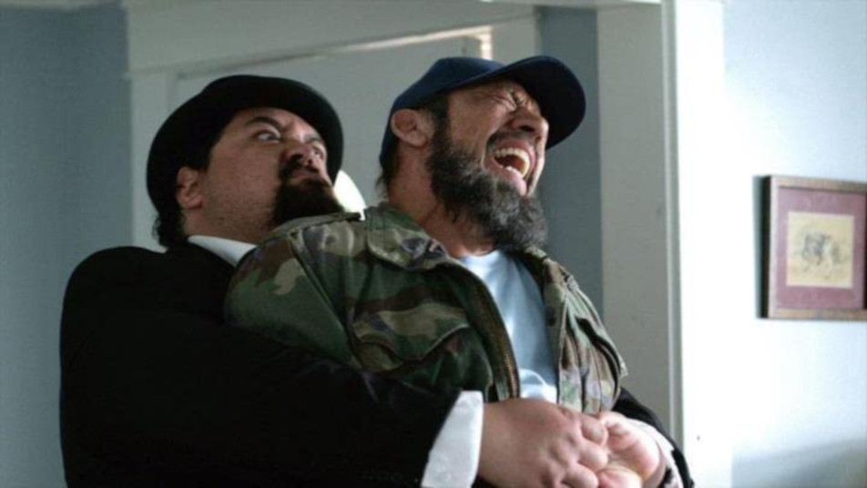 Churchill (Tyler Tuione) traps Frank (Danny Trejo) in a bear hug in "Bad Ass." (Photo courtesy IMDb.com)
