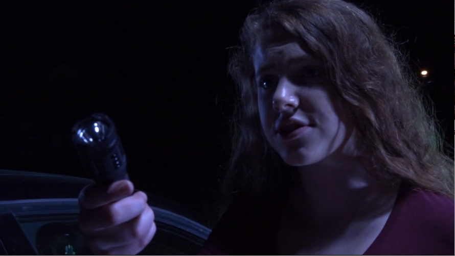Rachel (Sierra Stodden) wields the "taser" she's going to use on her stepdad in "Clownado." (Screen capture from DVD by reviewer Ben Nagy)