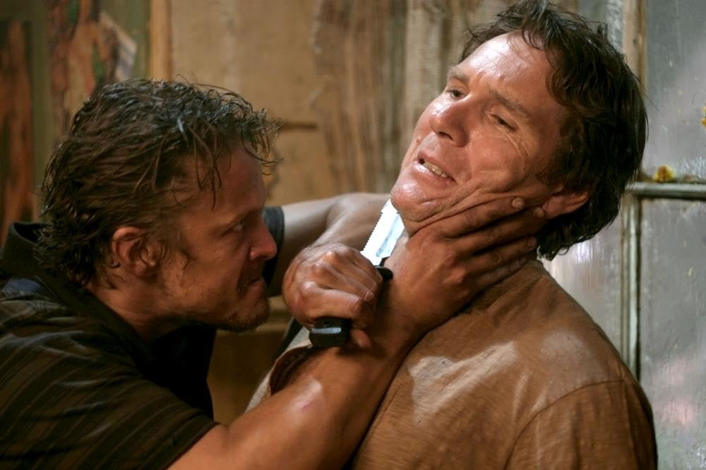No. 1 redneck son Jimmy (David Lyons), left, and Rob (Robert Taylor) discuss the intricacies of the Australian legal system in "Storm Warning." (Photo courtesy IMDB.com)
