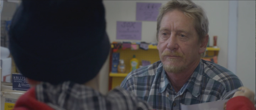 The shopkeeper (John Plympton) helps Lucy out as she visits his store in "Lost Gully Road." (Screen capture from DVD by reviewer Ben Nagy).