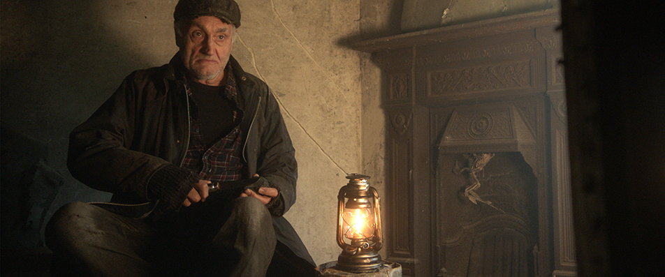 Ben Nagy reviews 'The Village in the Woods': Aspiring pub owners meet Druidic cabal looking for lunch 5 Arthur (Sidney Kean) has been squatting in the pub in "The Village in the Woods" for a long time whittling and perfecting his scowling technique. (Photo courtesy IMDB.com)