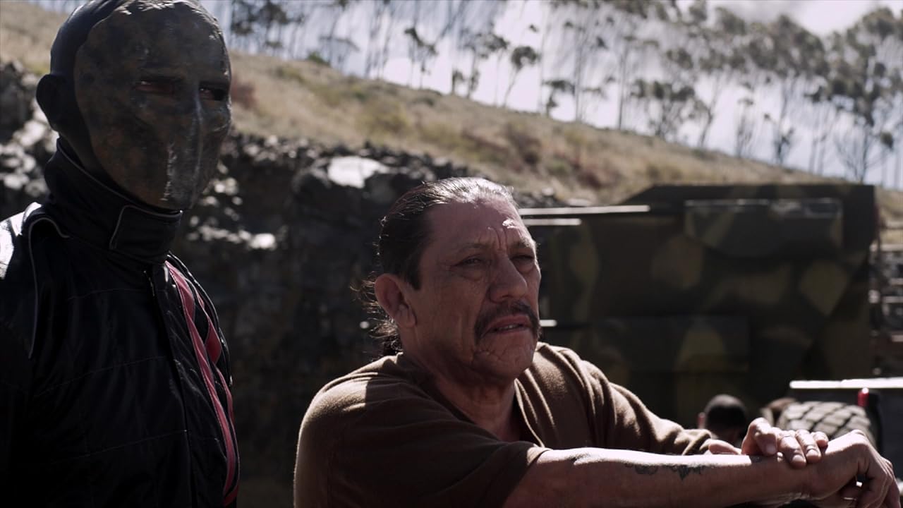 Frankenstein (Luke Goss) and crew chief Goldberg (Danny Trejo) talk Death Race shop in "Death Race 3: Inferno." (Photo courtesy IMDb.com)