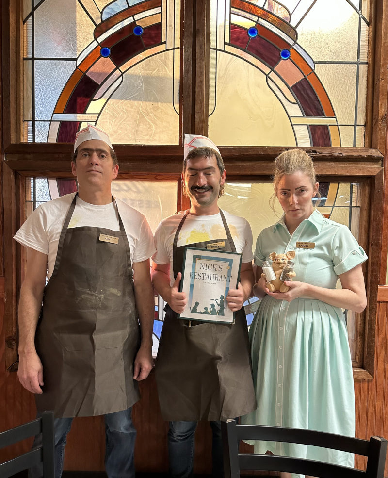The three members of the Gruoch family — Nick (Andrew Gordon), Jerry (Timmy H. Barron) and Laddie (Eileen Earnest) in their establishment. (Courtesy IMDB.com)